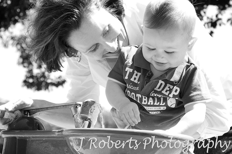 Mother and son drinking from bubbler - family portrait photography sydney